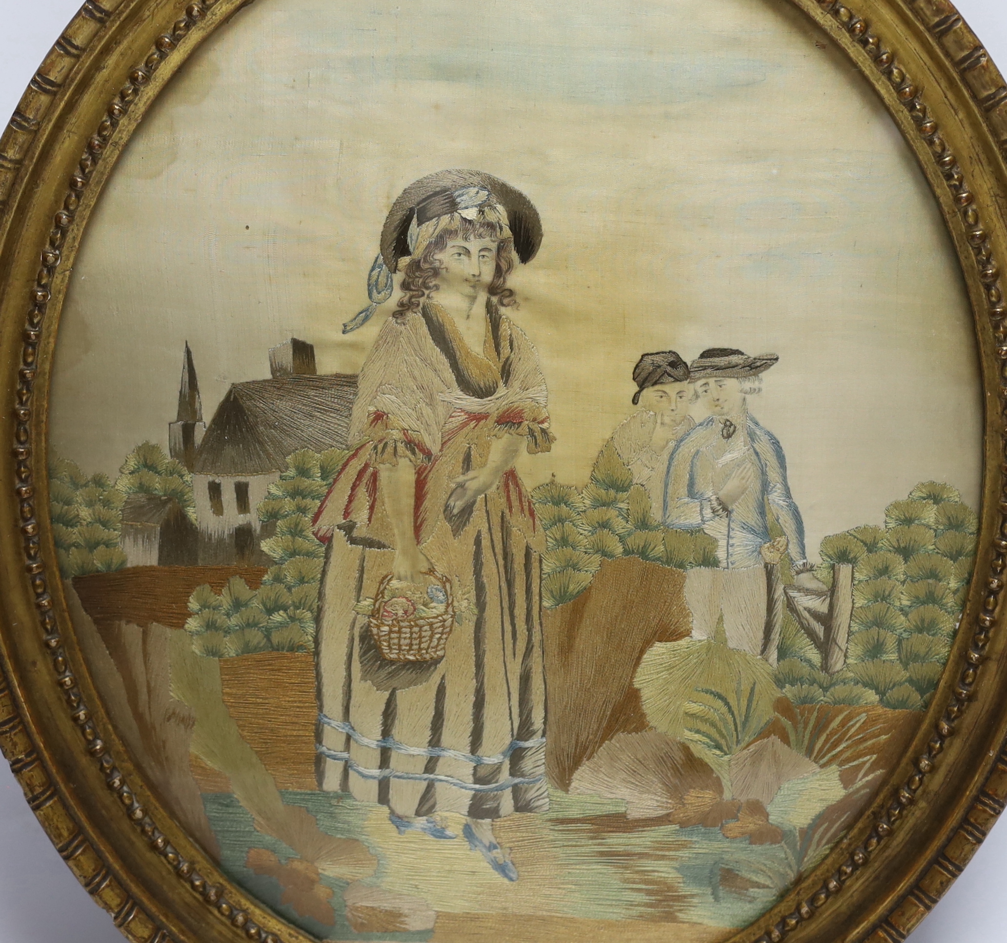 An oval framed regency needlework on silk, 